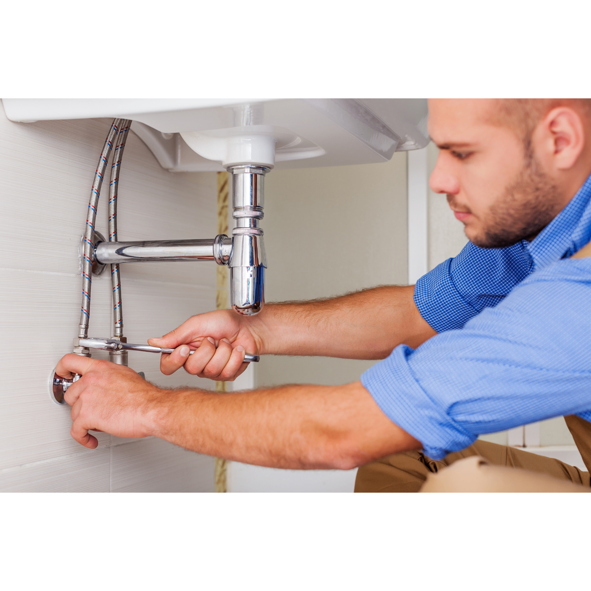 North Peak Plumbing plumber servicing pipes under a sink in the Seattle area